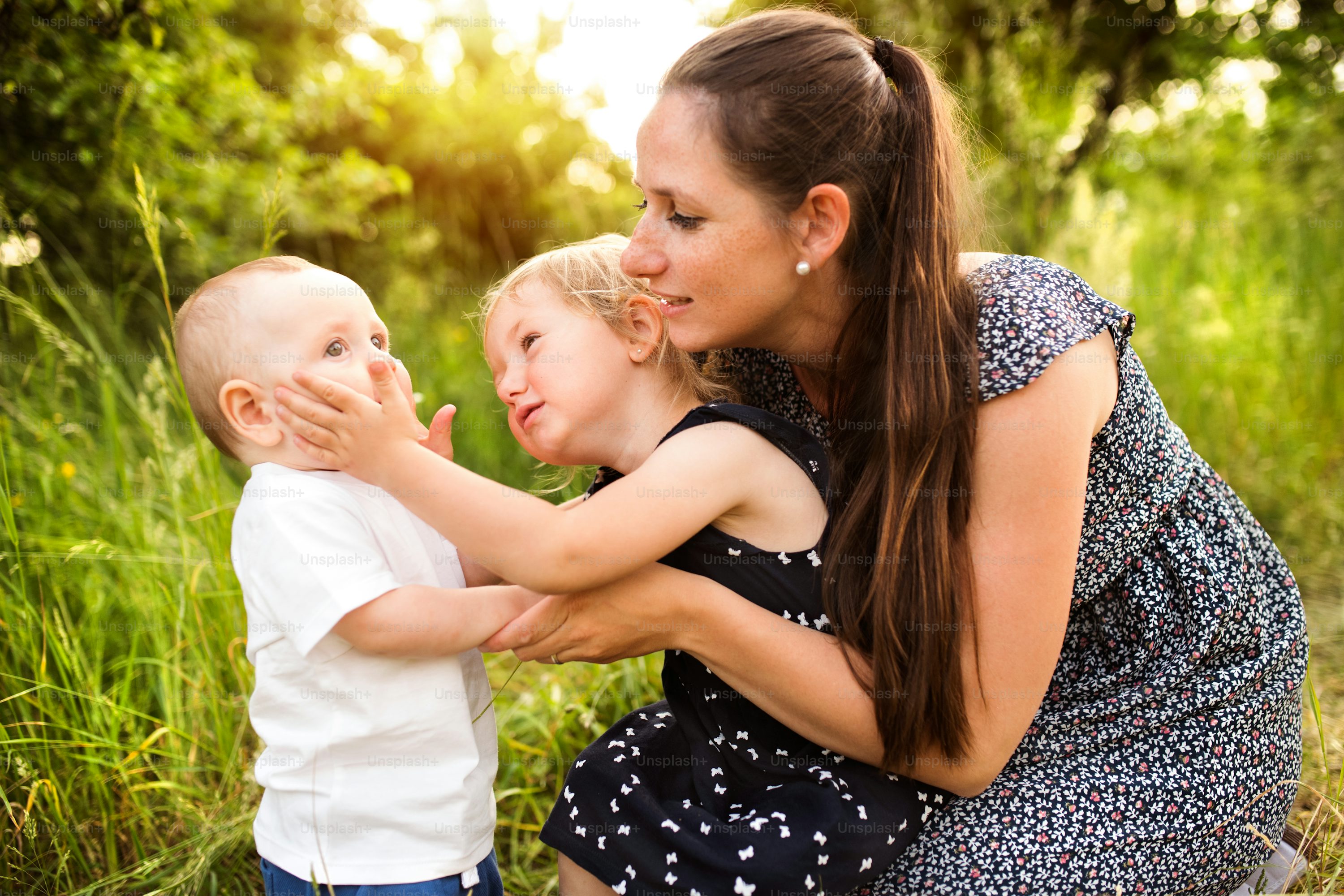 Beautiful young mother with little children